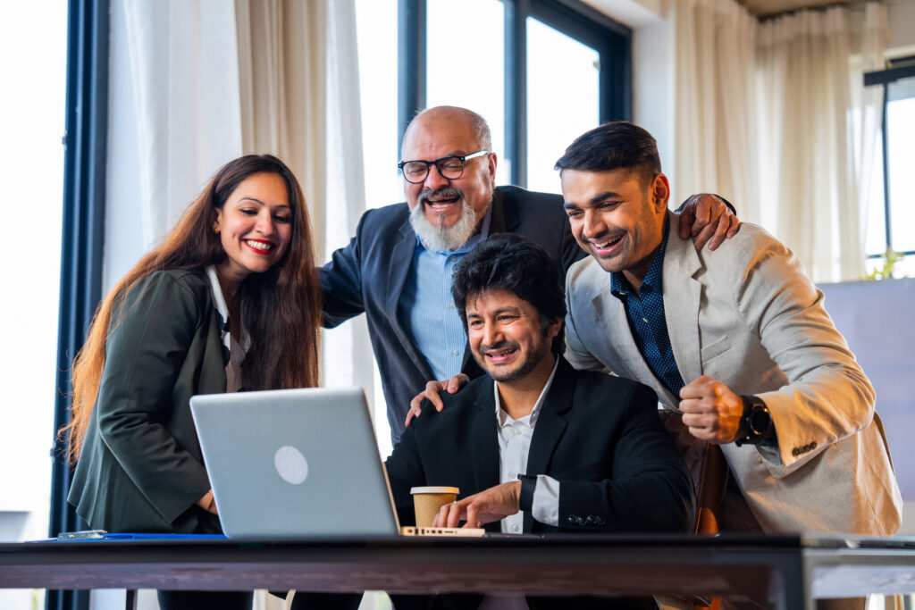 "Happy Indian professionals celebrating work abroad opportunities together"